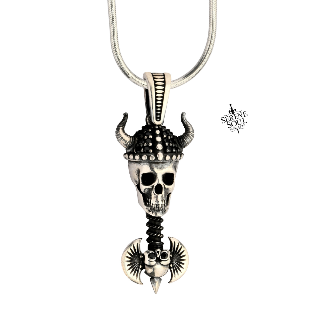 Skull pendant with horns and wings on a white background