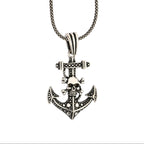 Silver anchor pendant necklace on a white background