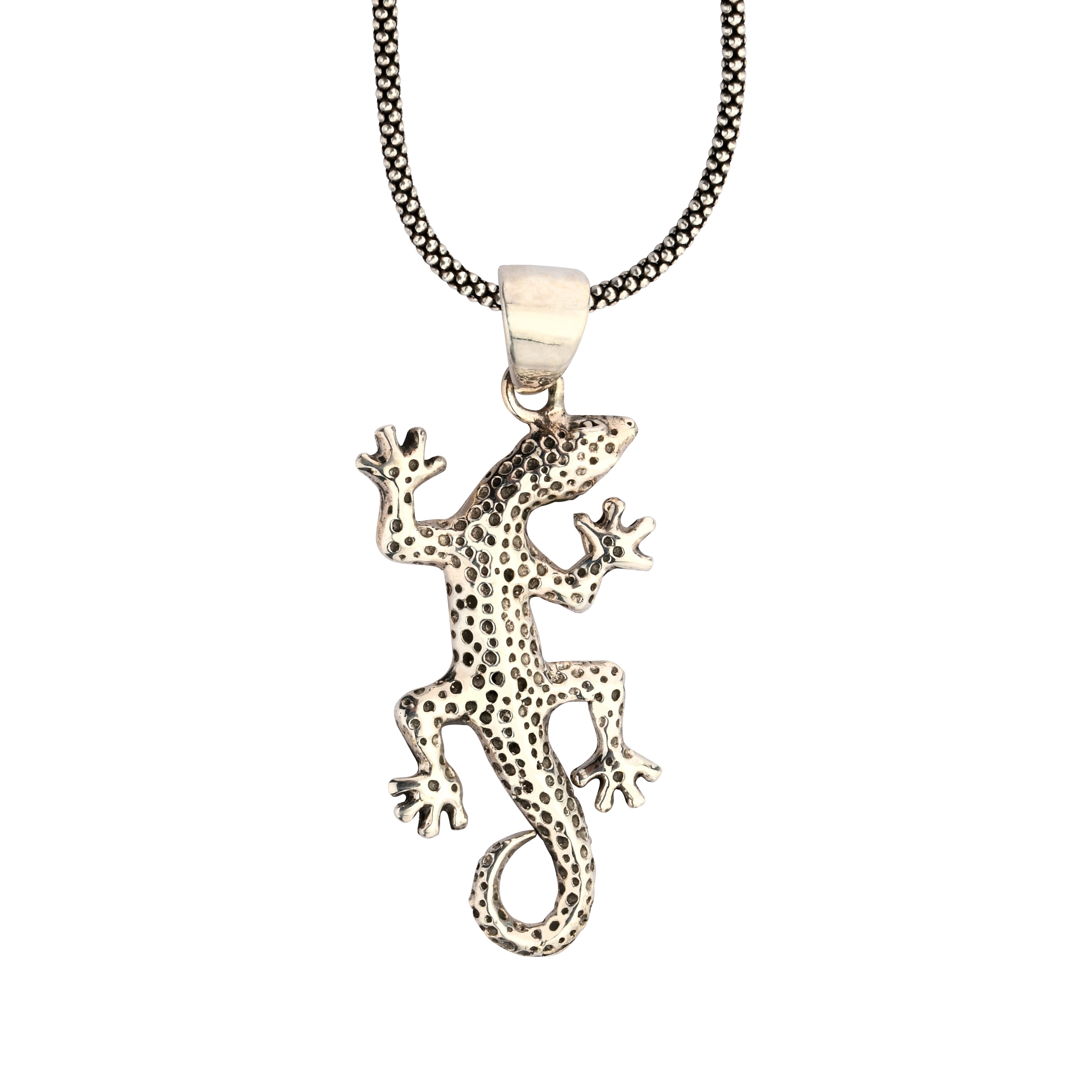 Gecko-shaped pendant on a chain against a white background