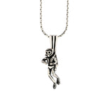 Silver monkey pendant on a chain against a white background