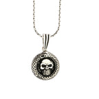 Skull pendant necklace on a white background